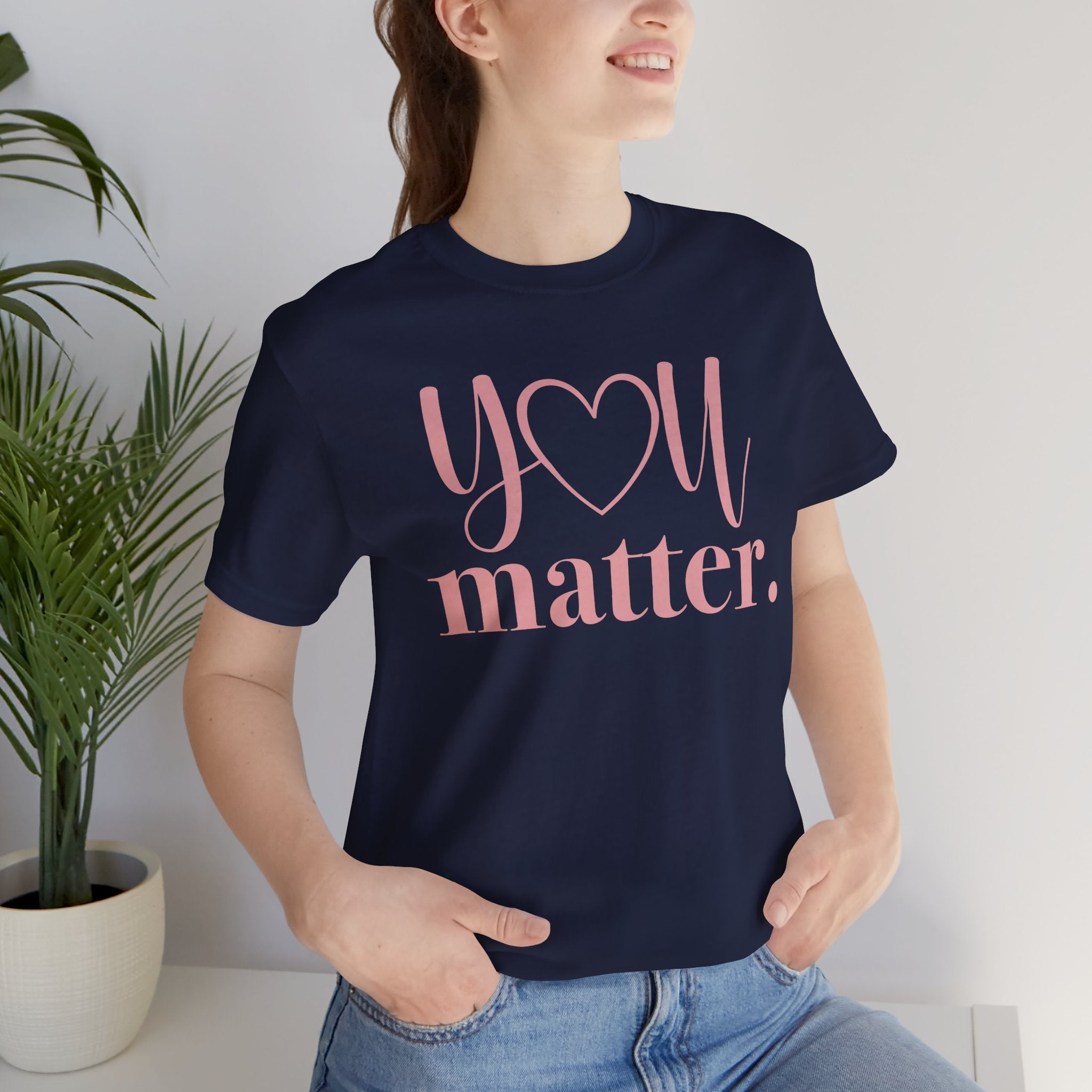 Person wearing a navy blue t-shirt with 'YOU matter.' text