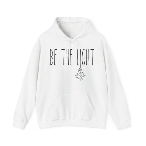 White hoodie with 'BE THE LIGHT' text and light bulb graphic 