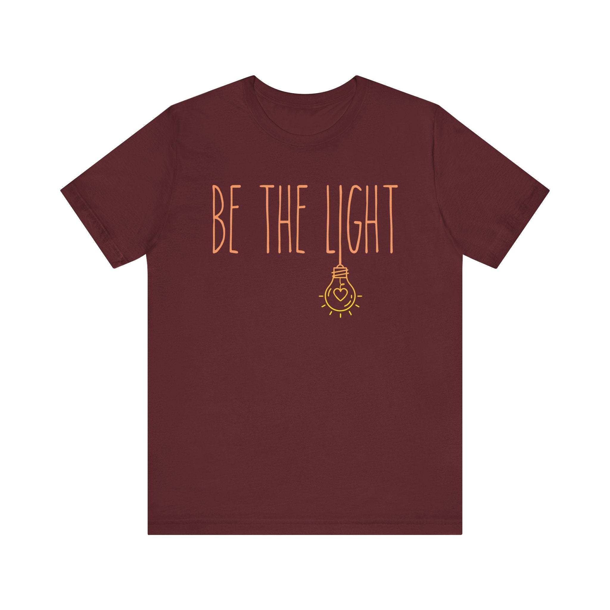 Maroon t-shirt with 'Be the Light' text 