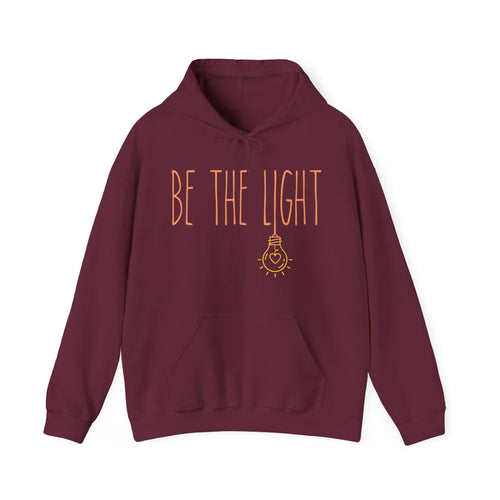 Maroon hoodie with 'BE THE LIGHT' text 